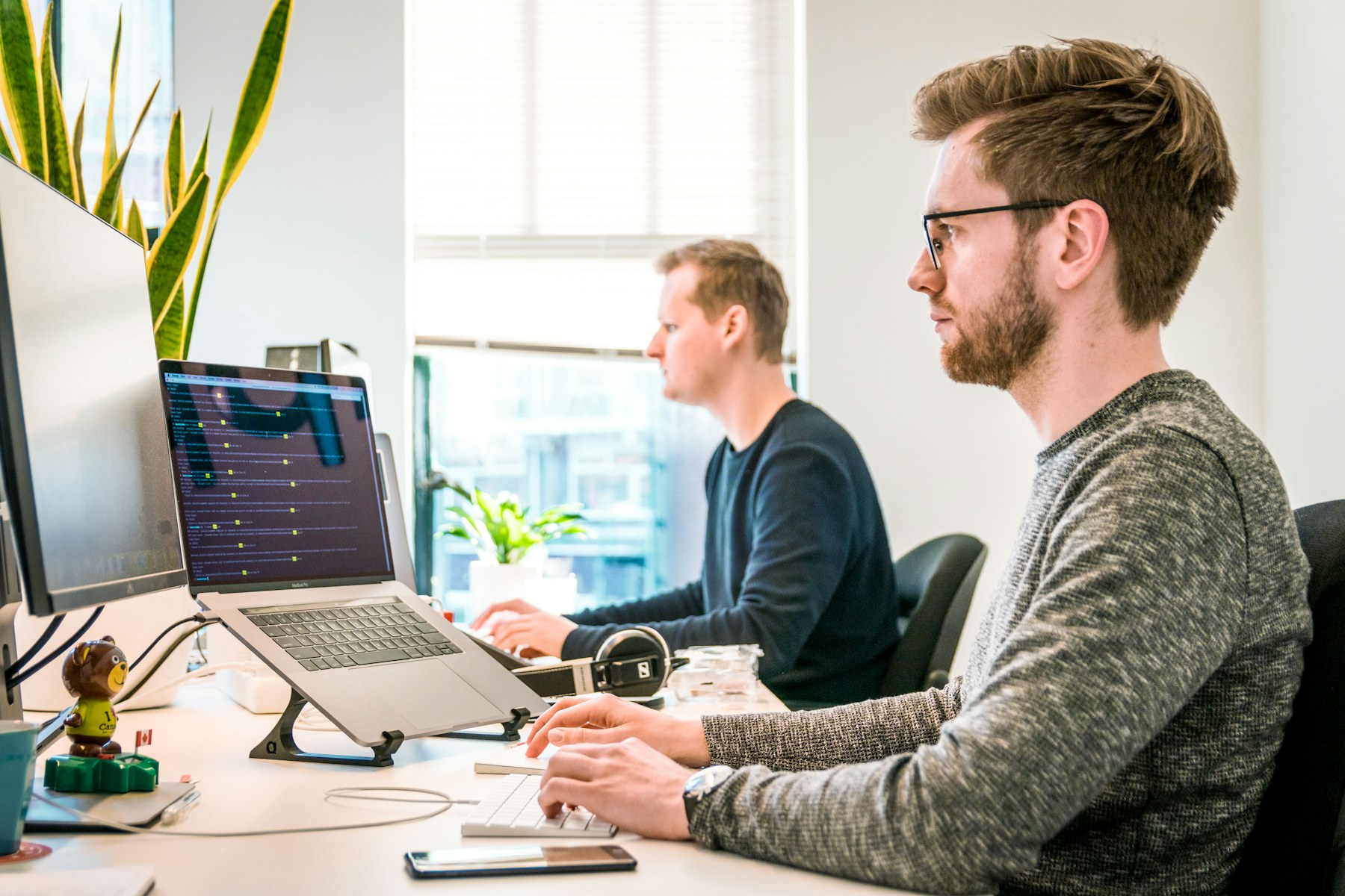 Professional services colleagues collaborating in a modern office